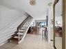 Take the steps from the first living level up to your primary ensuite bedroom, 2nd bedroom and 2nd bath