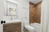 Full bathroom featuring shower / tub combo with curtain and vanity