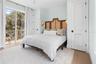 Guest House Bedroom with dual closets and switched wall sconces