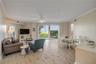New floors throughout. Corner unit with 3 private walkout patios on the first floor