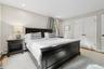 Bedroom with light wood finished floors, recessed lighting, a closet, and ornamental molding