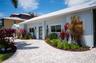 Beautifully landscaped property and a brick paver circular driveway