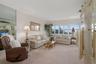Cozy living area featuring leather furnishings and a view to the beautiful beach!