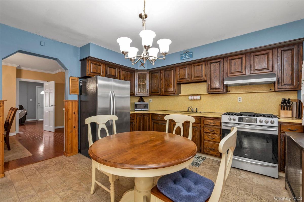 Eat In Kitchen with SS Appliances and Solid Wood Cabinets