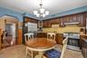 Eat In Kitchen with SS Appliances and Solid Wood Cabinets