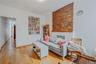 Sitting room with wood-type flooring and a fireplace