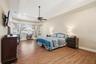 Private primary suite with large picturesque windows allowing a view of the backyard