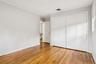 Unfurnished bedroom featuring ornamental molding, a closet, and light wood-type flooring