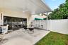 Fabulous backyard w/ new concrete pad and covered shade structure w/ fan to enjoy the backyard and weather