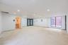 Spare room with concrete flooring, recessed lighting, and electric panel