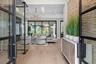 Inside, rich wood flooring flows seamlessly throughout.