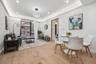 Dining area featuring light wood-style flooring, recessed lighting, a wall of windows, and baseboards