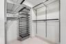 ..  Master  Bedroom Walk In Closet with designer built-ins including ELFA Master Closet System.