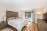 Bedroom with light wood-style flooring and access to outside