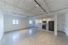 Below grade area with high end refrigerator and baseboards