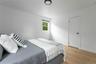 Bedroom featuring light wood-style floors and baseboards