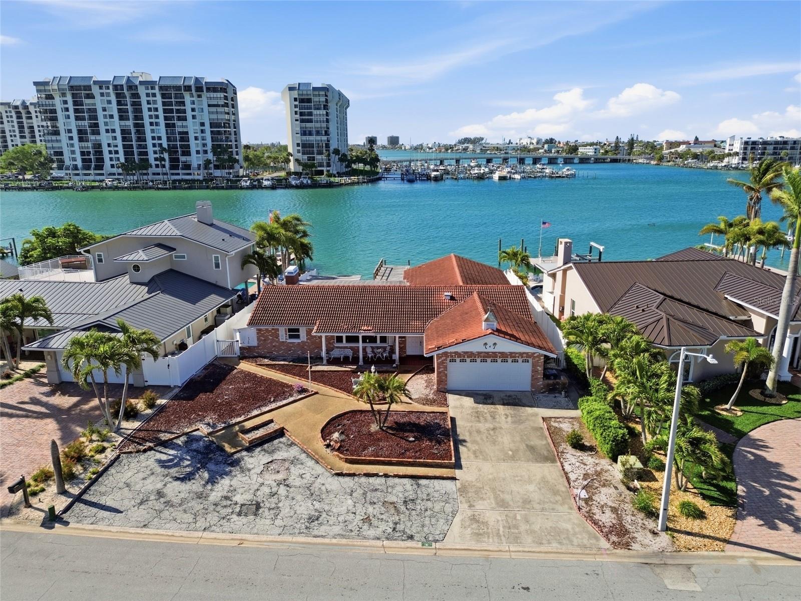 Drone shot of 4 Bellevue Drive looking south at The Devil's Elbow on the Intracoastal and the one bridge to the Gulf of Mexico in the foreground on th