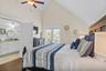 Top floor primary king bedroom with en-suite and private balcony