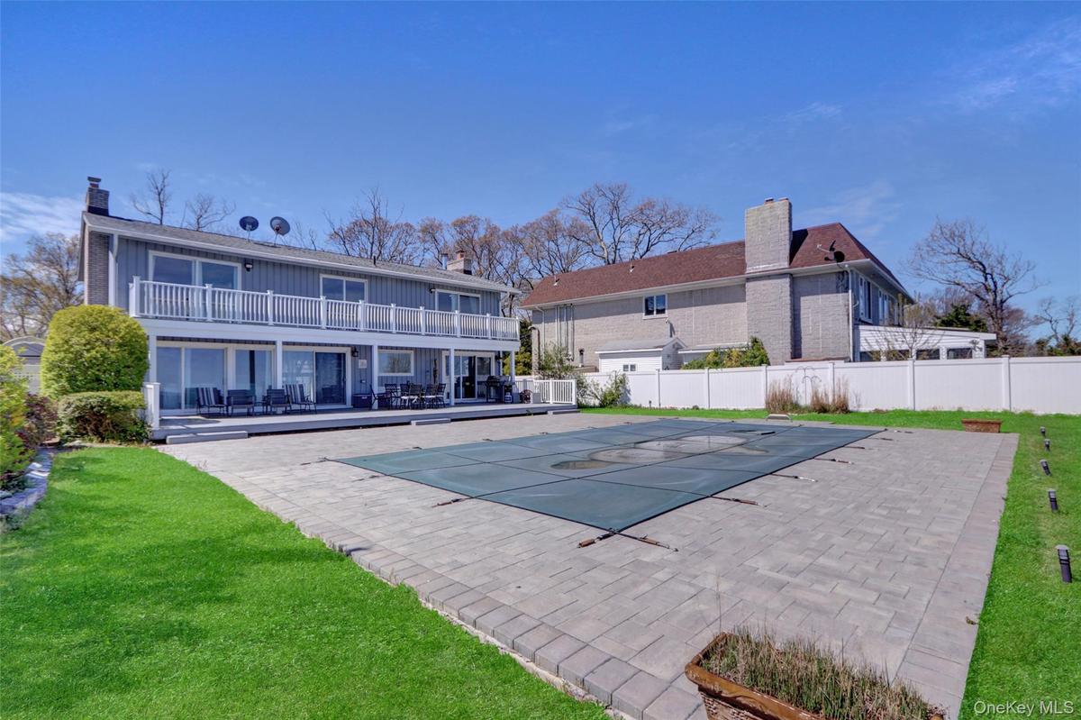 View of swimming pool featuring a patio and a balcony