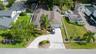 “Side aerial view showing lot depth and fenced-in privacy