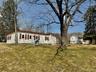 Manufactured / mobile home with a front lawn