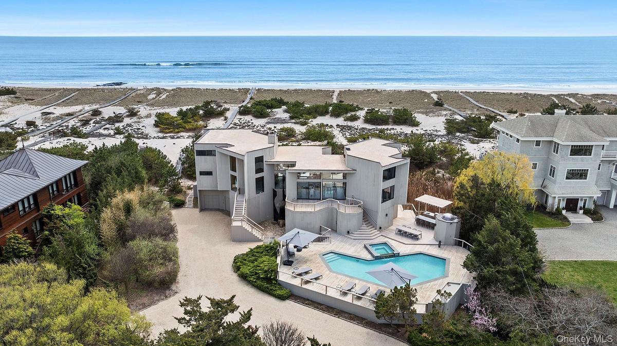 Aerial view with a water view and a beach view