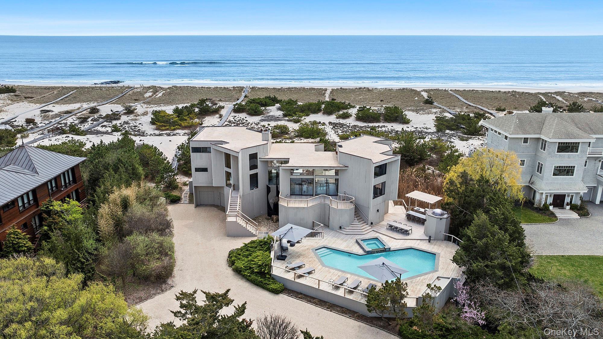 Aerial view with a water view and a beach view