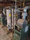 Utilities featuring water heater and a heating unit