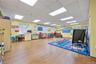 Game room with a paneled ceiling and wood finished floors