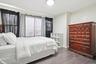 Room featuring wood-finish flooring, a flush-mount ceiling light fixture, and light-toned wall paint