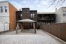 Rear view of house with a gazebo and a patio area