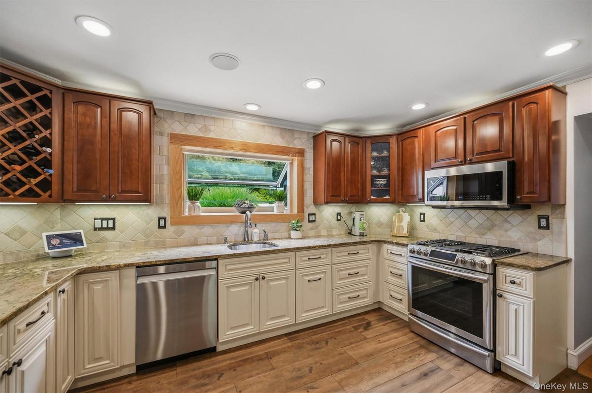 Stainless steel appliances, custom cabinetry and don't overlook the garden window!
