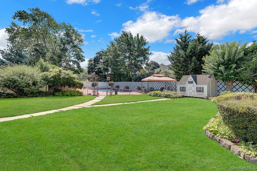 Back Yard offers a private retreat surrounded by lush, professionally landscaped grounds