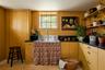 Kitchen featuring open shelves and dark countertops
