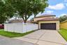 Outside, enjoy excellent CURB APPEAL, an attractive vinyl privacy fence and a rear-entry 2-CAR GARAGE with alley access, oversized workbench, and dire