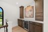 CUSTOM LOFT RETREAT WITH BUILT-IN STORAGE AND BEVERAGE FRIDGE