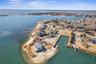 Bird's eye view featuring a view of the beach and a water view