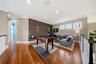 Upstairs with game room with its built in wood wall feature is striking and sure to gather guests