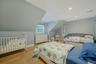 Two twin beds with trundles and a crib