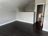 Bonus room with wood finished floors and lofted ceiling