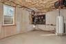 Utility room featuring gas water heater