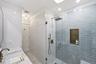 New Tile and Brass Finishes give this Bathroom an Elegant Spa Feel!