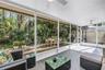 Outdoor Screened, Roofed and Outdoor Natural Shade elevated on the paver patio