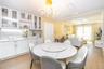 Dining area featuring light wood-style floors, a chandelier, crown molding, and recessed lighting