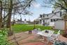 Enjoy a spacious flat backyard featuring a charming patio ideal for entertaining and unwinding.