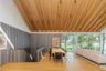 Dining area featuring vaulted ceiling, wooden ceiling, and wood finished floors