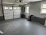 Garage with a garage door opener and electric panel