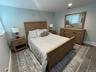 Bedroom with baseboards and recessed lighting
