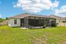 Extended lanai is full screened for year-round comfort.