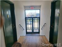 Foyer with wood finished floors